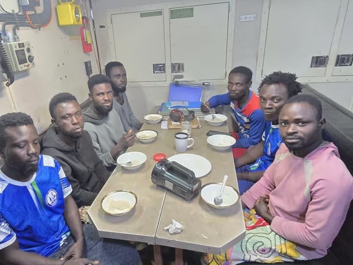 The seven Ghanaian fishermen rescued after their canoe Second Chance drifted into Beninese waters, photographed aboard a vessel after the rescue by Ghana's Information Services Department.